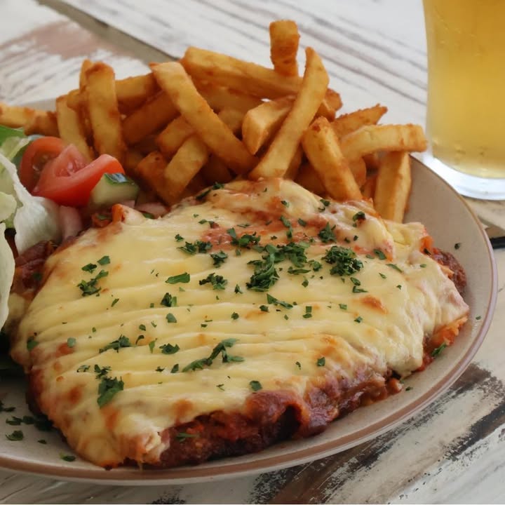 Featured image for “Just a heads up – Parmy Night is on tonight from 5 pm! Choose from three delicious options and dig into your favourite.”